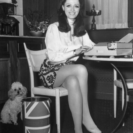 (Original Caption) Who is better to write about show business than an actress that just left? Getting much publicity about her first novel, which has just been published, is ex-actress Jackie Collins. Her book, The World is Full of Married Men, is a down-to-earth sexy story about show business in general. The book cover features five men in bed with a blonde.